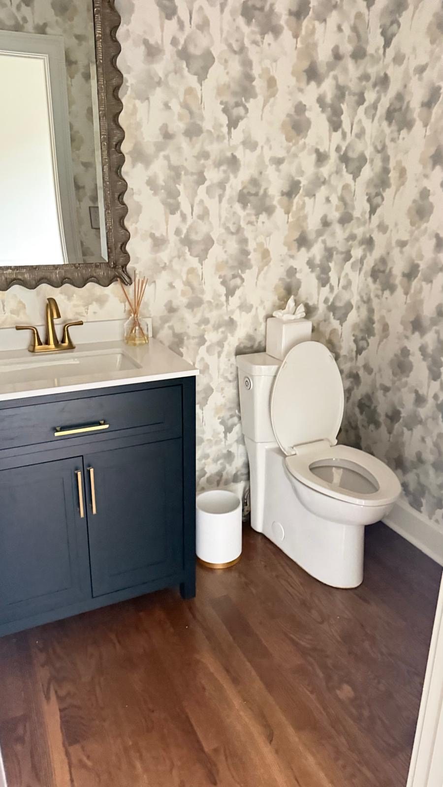 Powder room with vanity, faucet and toilet installed