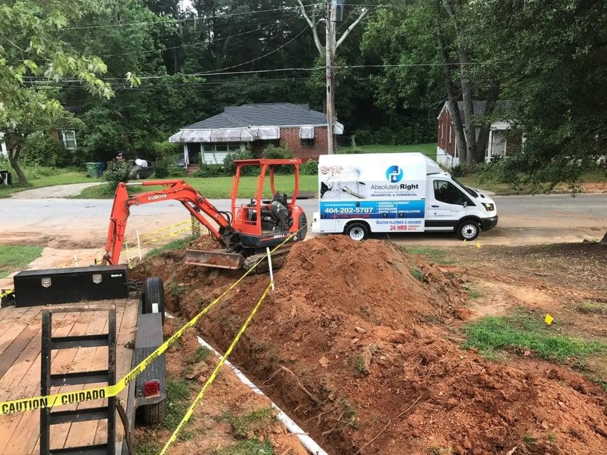 Absolutely Right Plumbing work van parked beside an open trench and mini excavator at a residential job site